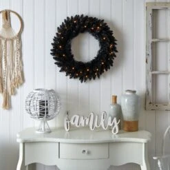 24” Black Artificial Wreath With 35 Warm White LED Lights -Artificial Trees Store artificial 24 black artificial wreath with 35 warm white led lights nearly natural 529860
